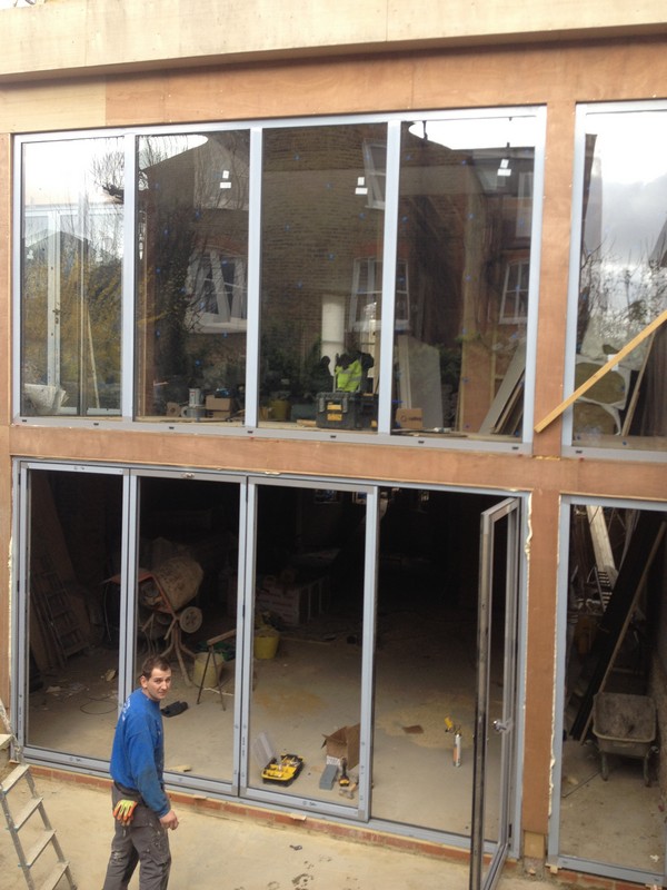 Aluminium bi-fold doors with two-storey glazing in Wembley