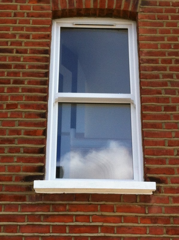 uPVC sash window on Victorian red brick house in Wembley